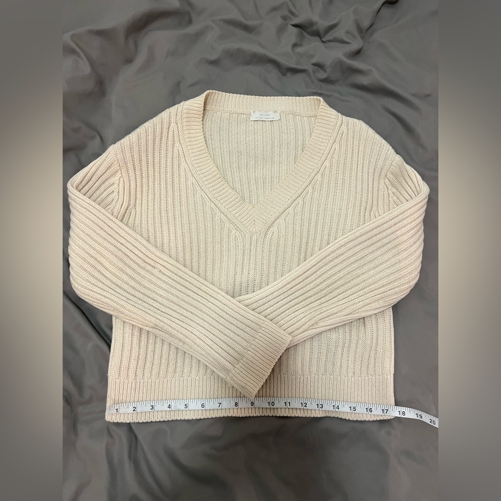 Sweater with tie in back
